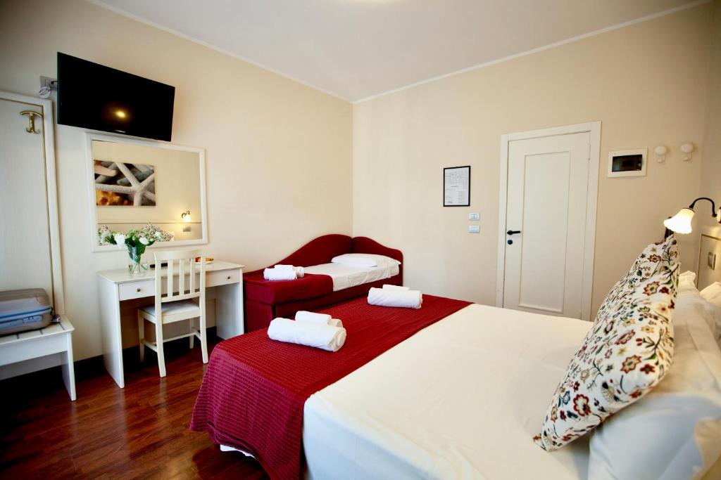 Postel nebo postele na pokoji v ubytování Hotel Maestri