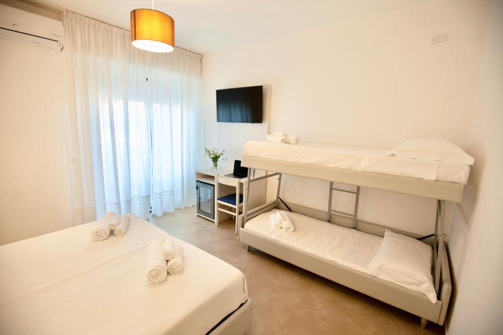 Postel nebo postele na pokoji v ubytování Hotel Maestri