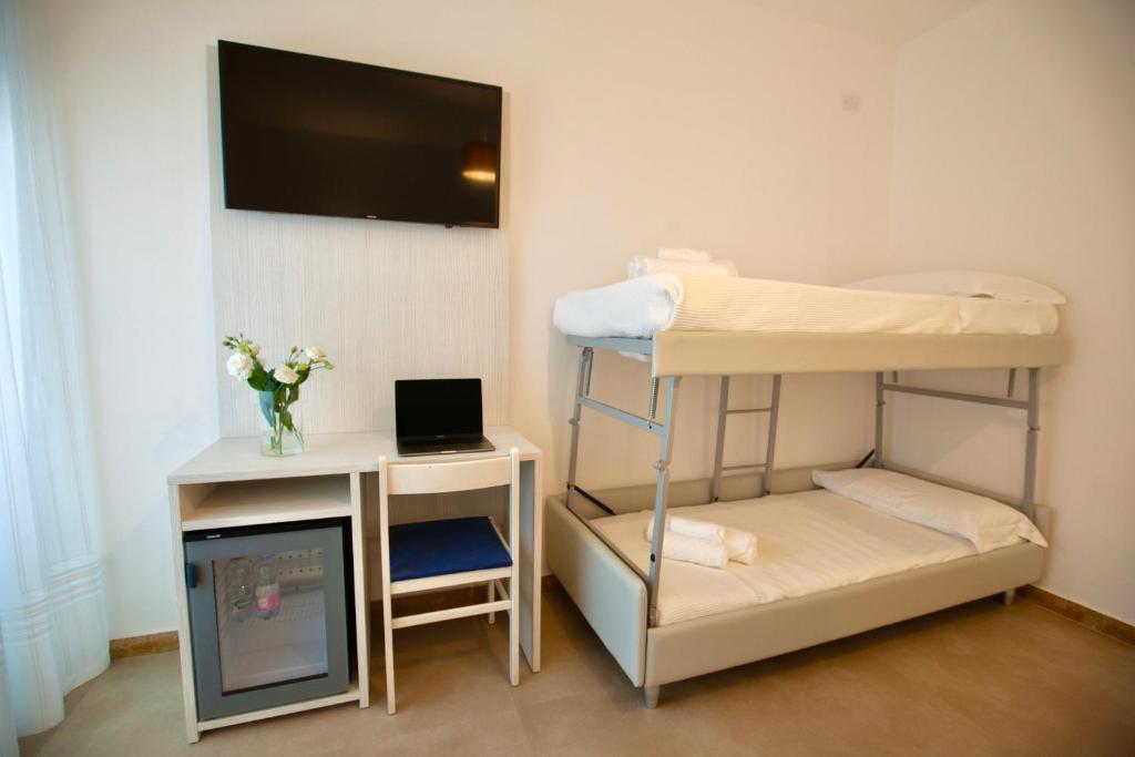 Postel nebo postele na pokoji v ubytování Hotel Maestri