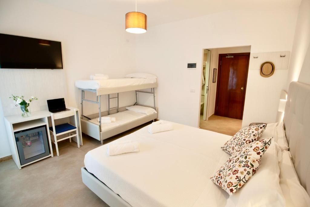 Postel nebo postele na pokoji v ubytování Hotel Maestri