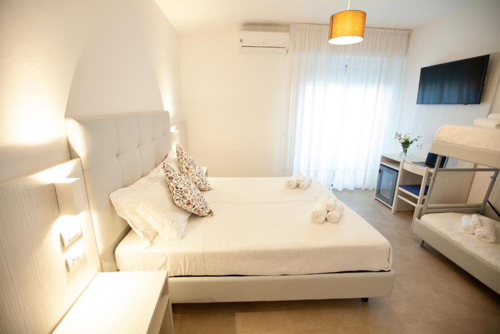 Postel nebo postele na pokoji v ubytování Hotel Maestri