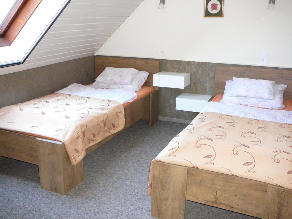 Postel nebo postele na pokoji v ubytování Dunakanyar Apartment