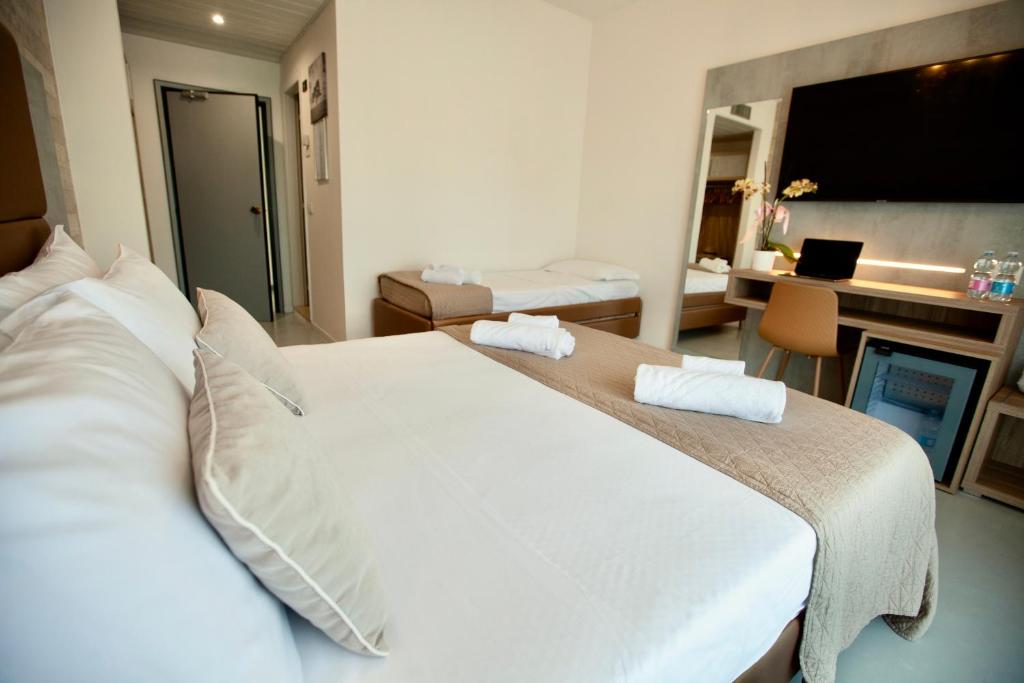 Postel nebo postele na pokoji v ubytování Hotel Maestri