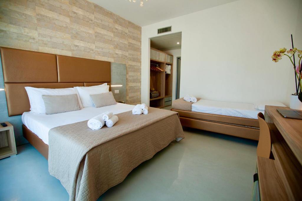 Postel nebo postele na pokoji v ubytování Hotel Maestri