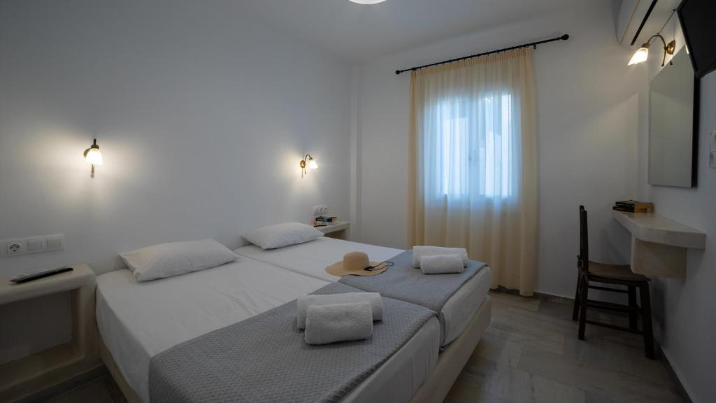 Łóżko lub łóżka w pokoju w obiekcie Aphrodite Hotel & Apartments