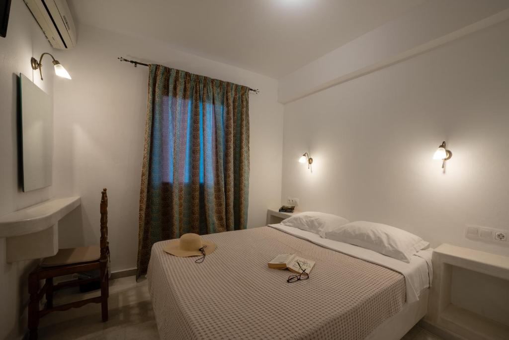 Łóżko lub łóżka w pokoju w obiekcie Aphrodite Hotel & Apartments