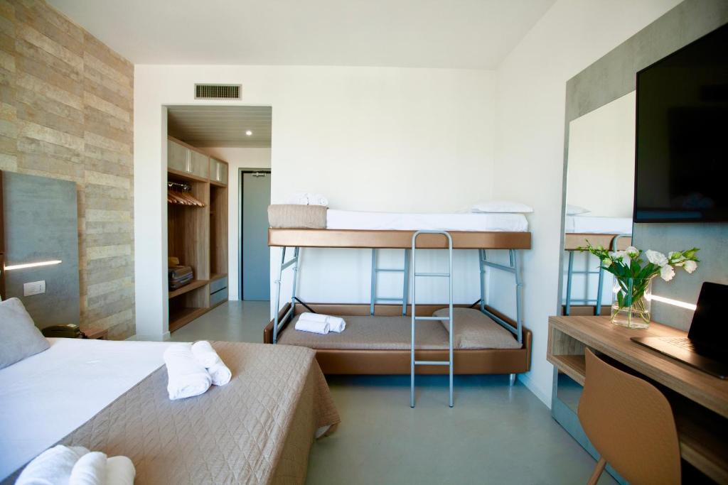 Postel nebo postele na pokoji v ubytování Hotel Maestri