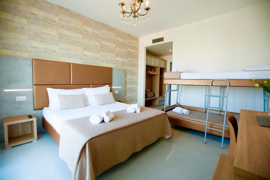 Postel nebo postele na pokoji v ubytování Hotel Maestri