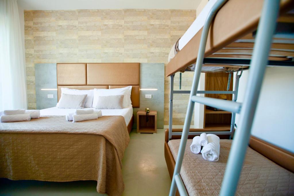 Postel nebo postele na pokoji v ubytování Hotel Maestri