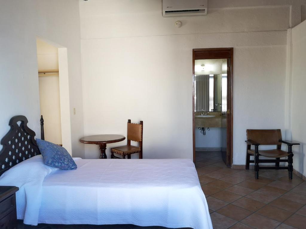 Postel nebo postele na pokoji v ubytování Hotel El Pescador