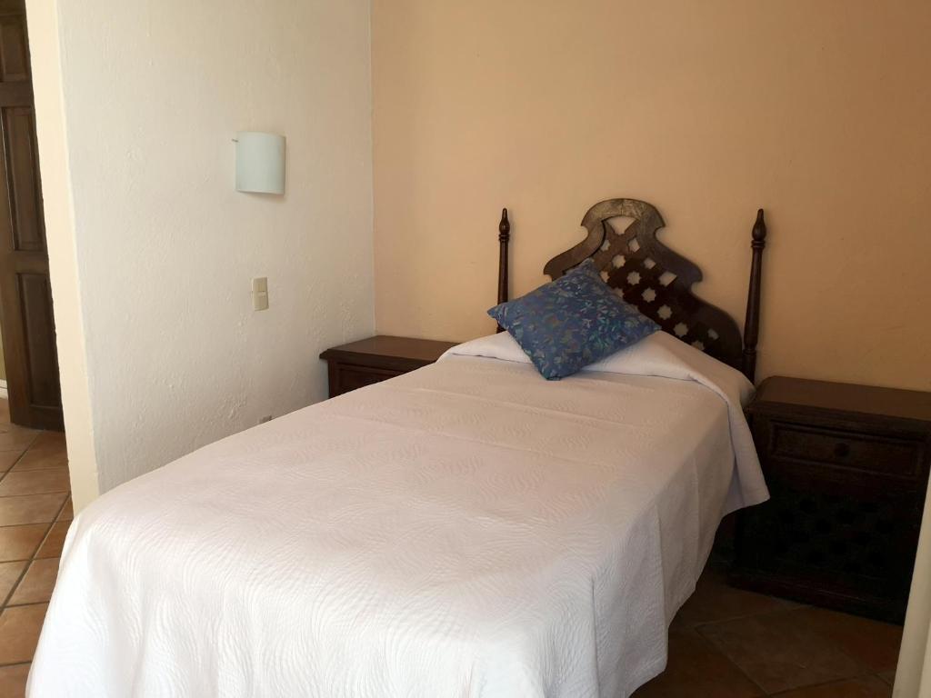 Postel nebo postele na pokoji v ubytování Hotel El Pescador