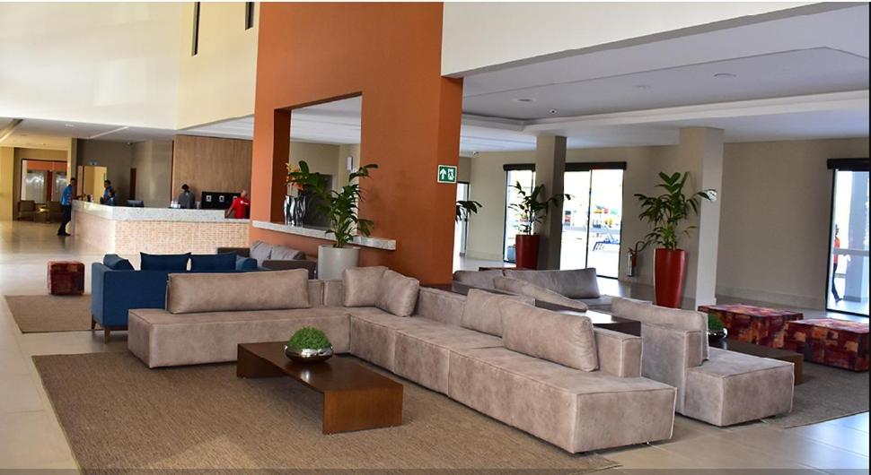 a large living room with a couch and a table at ALTA VISTA THERMAS RESORT in Caldas Novas