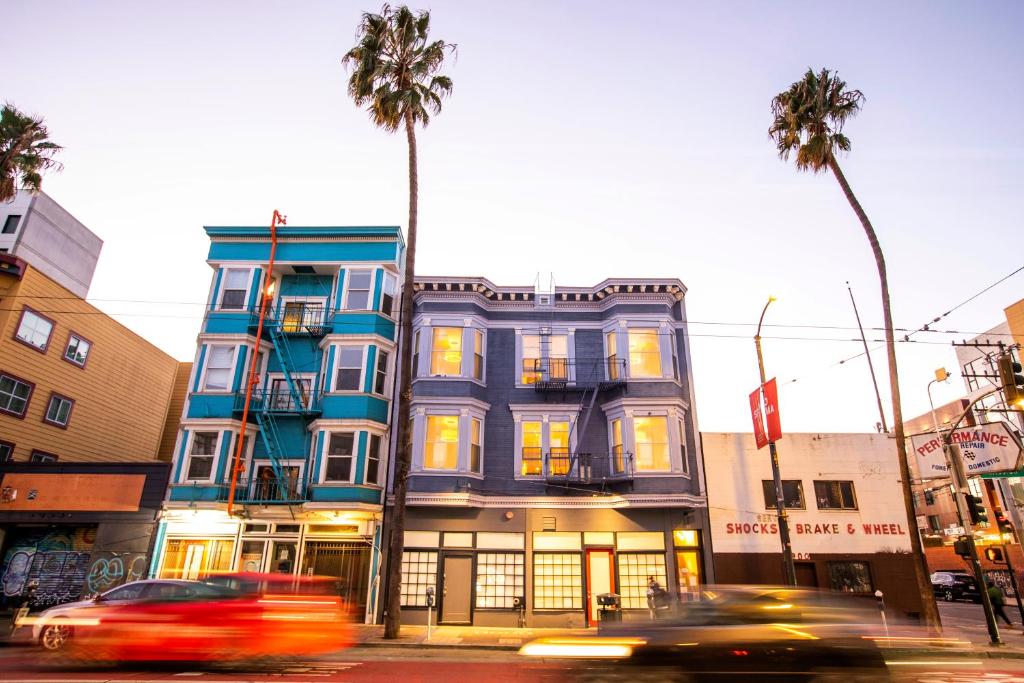 a building on the corner of a street with palm trees at 1906 Mission in San Francisco