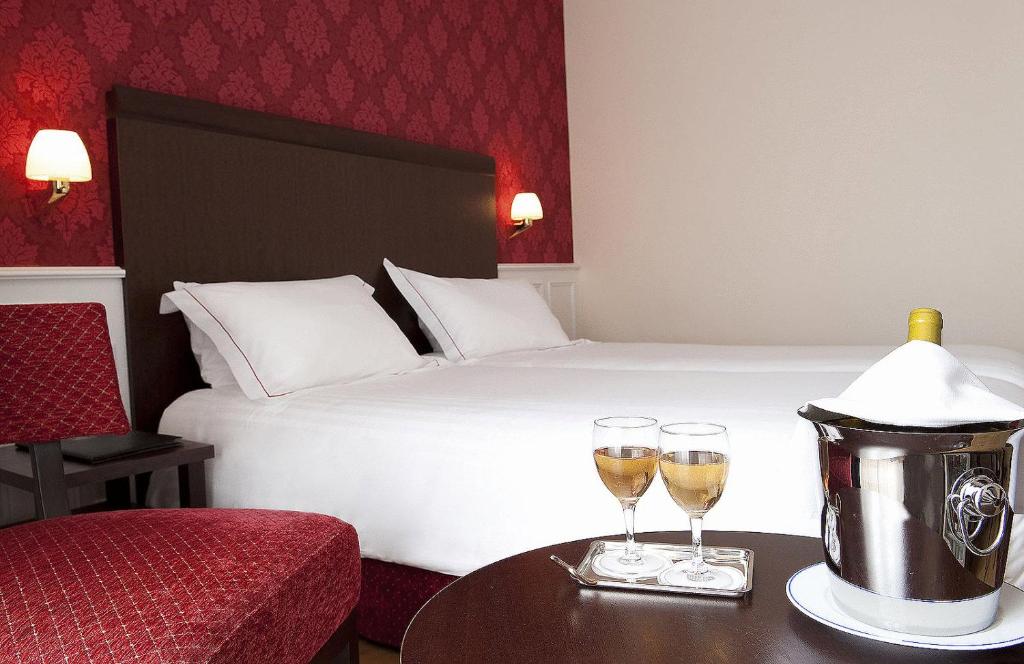Postel nebo postele na pokoji v ubytování Best Western Plus Hôtel D'Angleterre