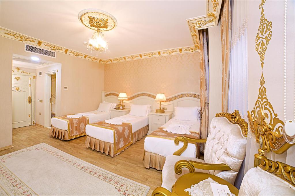 Postel nebo postele na pokoji v ubytování White House Hotel Istanbul