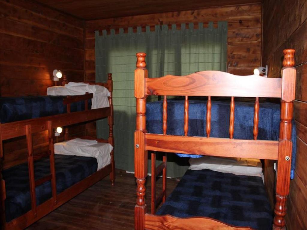 Postel nebo postele na pokoji v ubytování Hostel Meridiano 71