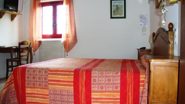 Postel nebo postele na pokoji v ubytování Hotel Pikassaria