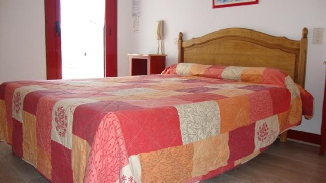 Postel nebo postele na pokoji v ubytování Hotel Pikassaria