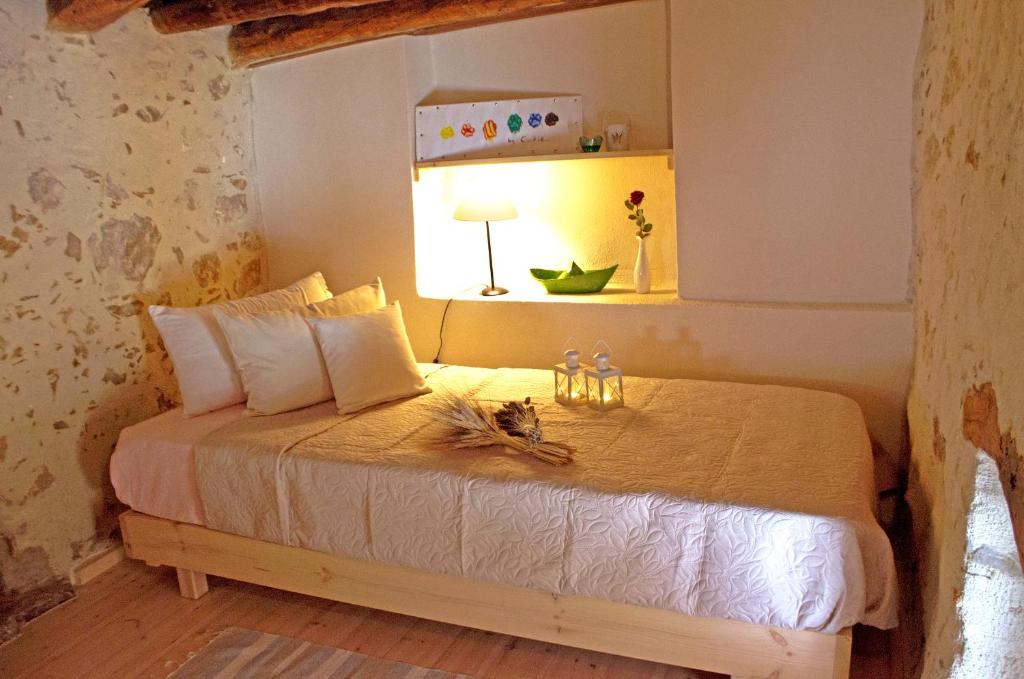 Łóżko lub łóżka w pokoju w obiekcie Villa Cosmakis