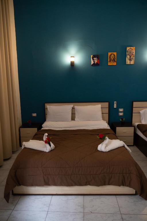 Postel nebo postele na pokoji v ubytování Hostgram Hotel
