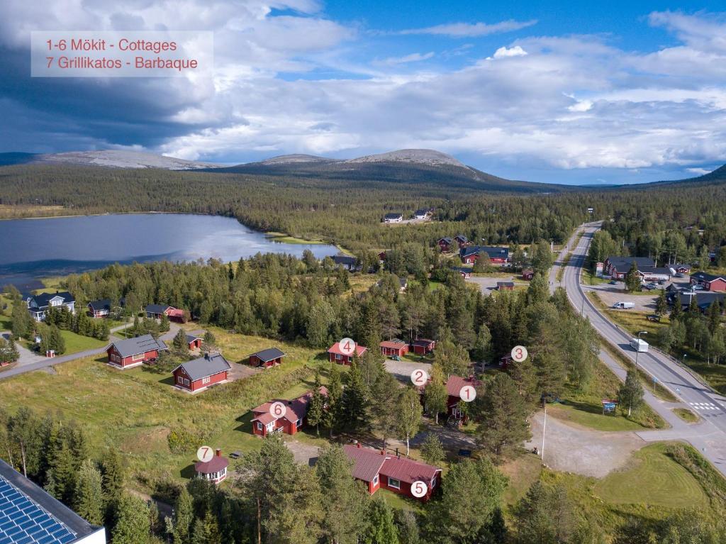 an aerial view of a small village with a lake at Ylläksen Yöpuu in Äkäslompolo