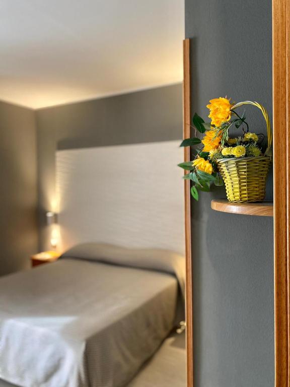 Postel nebo postele na pokoji v ubytování Hotel degli Amici