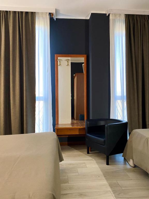 Postel nebo postele na pokoji v ubytování Hotel degli Amici