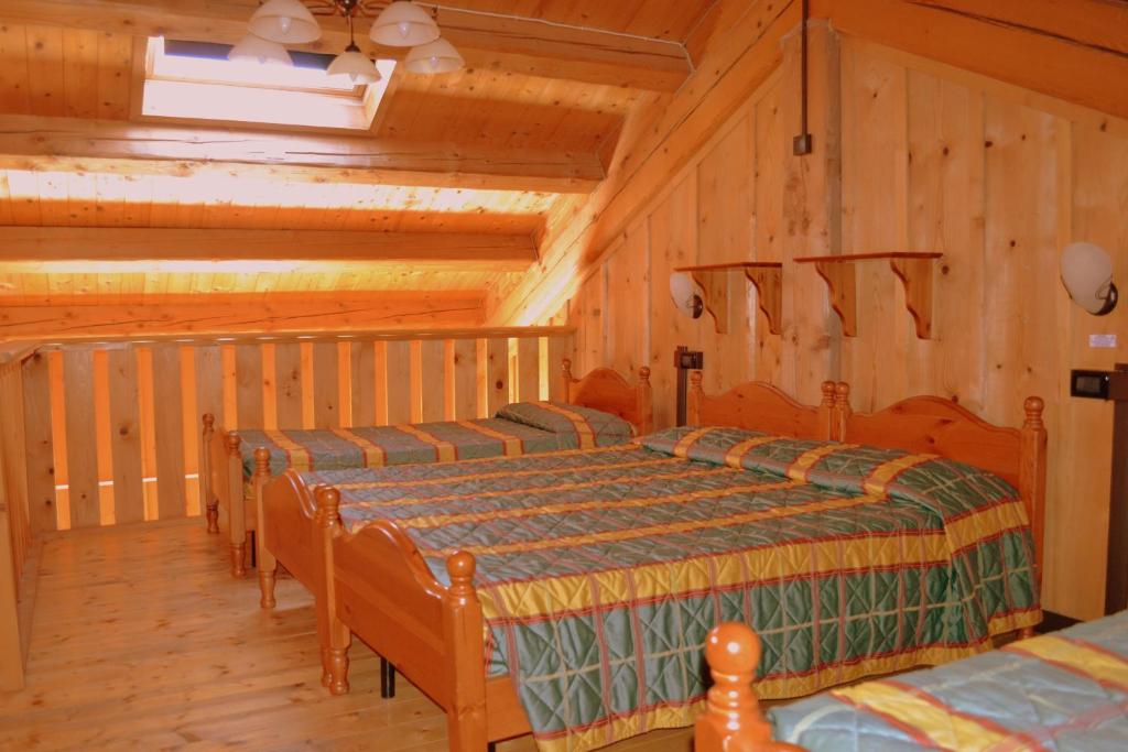 Postel nebo postele na pokoji v ubytování Albergo Rendola