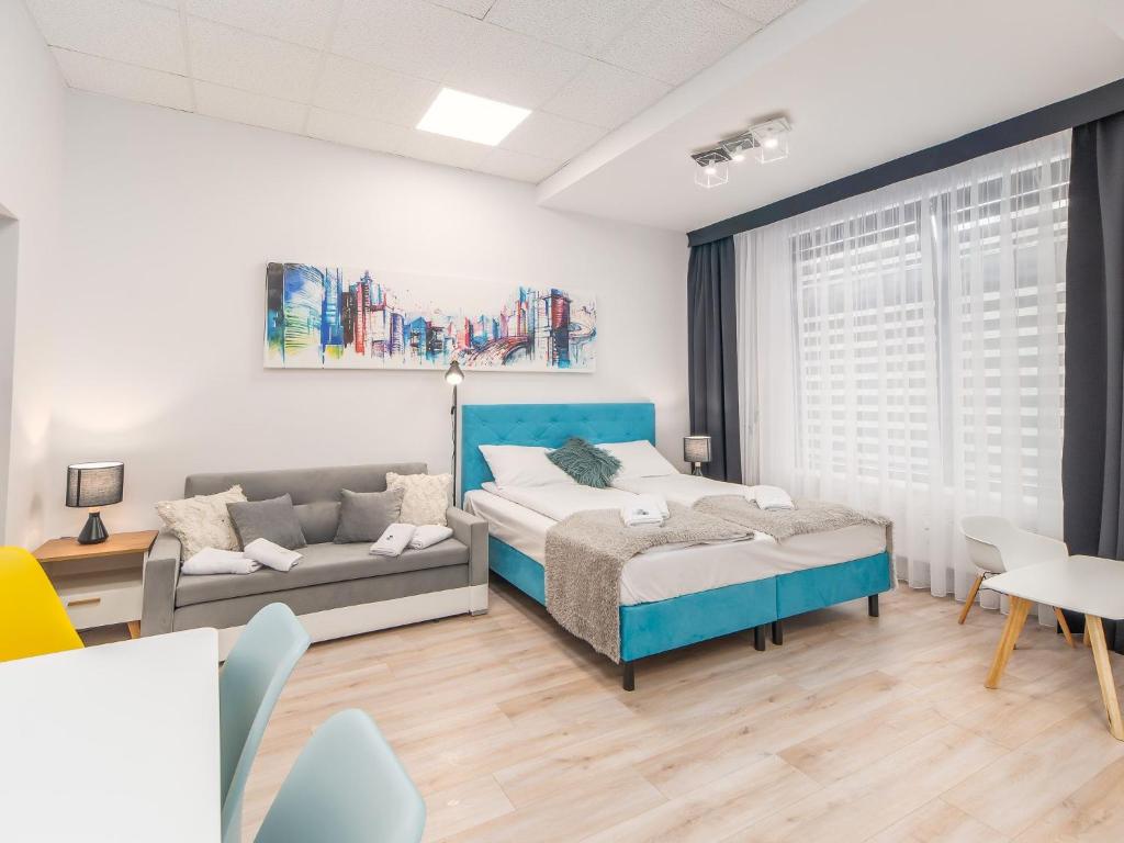 Posteľ alebo postele v izbe v ubytovaní ApartmentyPrzyMorzu Ogrody
