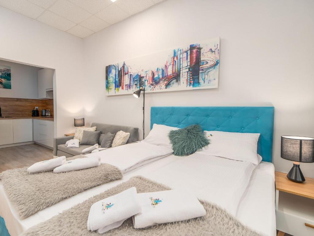 Posteľ alebo postele v izbe v ubytovaní ApartmentyPrzyMorzu Ogrody