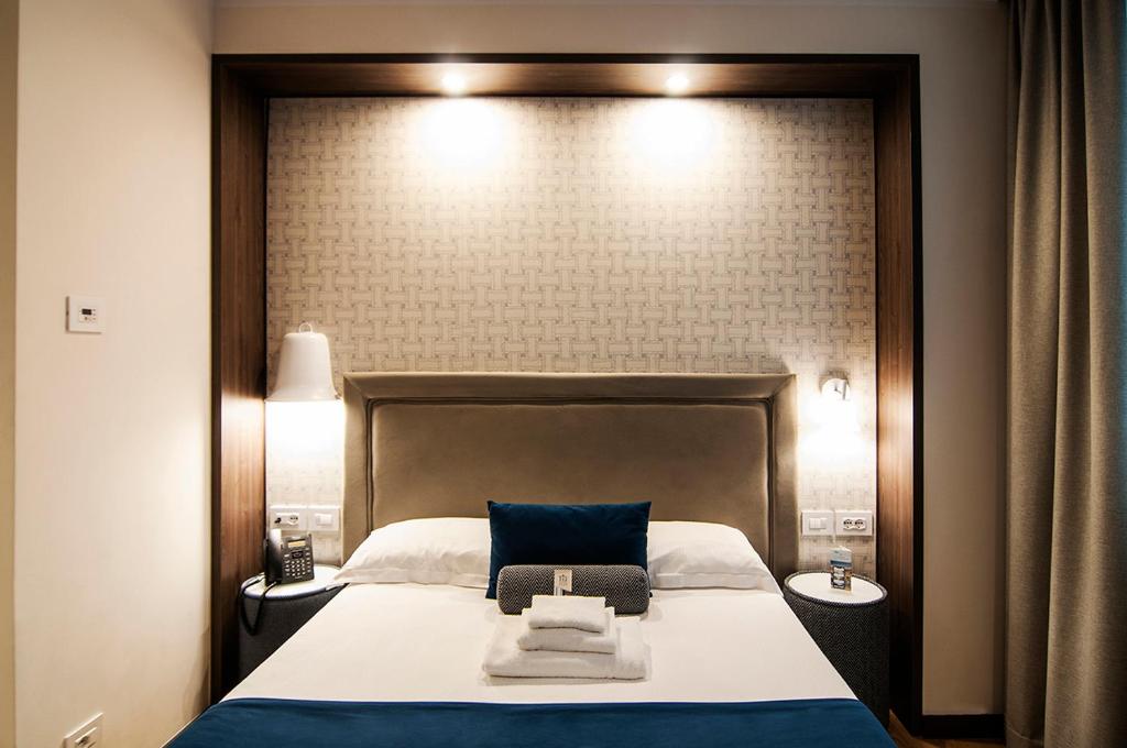 Postel nebo postele na pokoji v ubytování Fly Decó Hotel