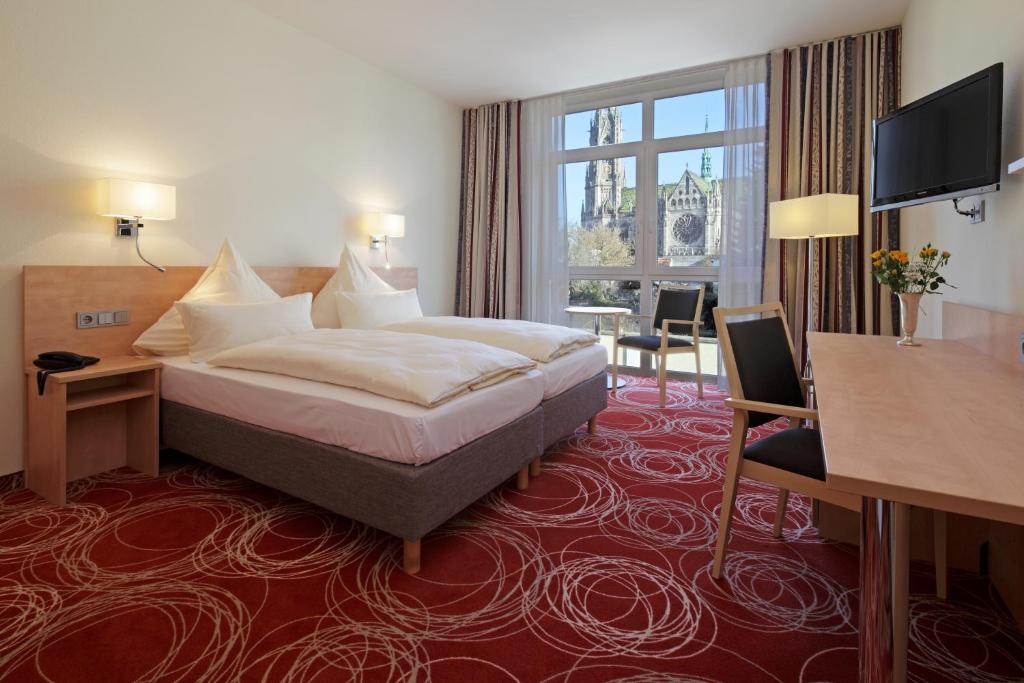 Postel nebo postele na pokoji v ubytování Hotel Löwengarten
