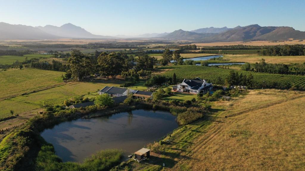 an aerial view of a house in the middle of a field at Raptor Rise in Tulbagh