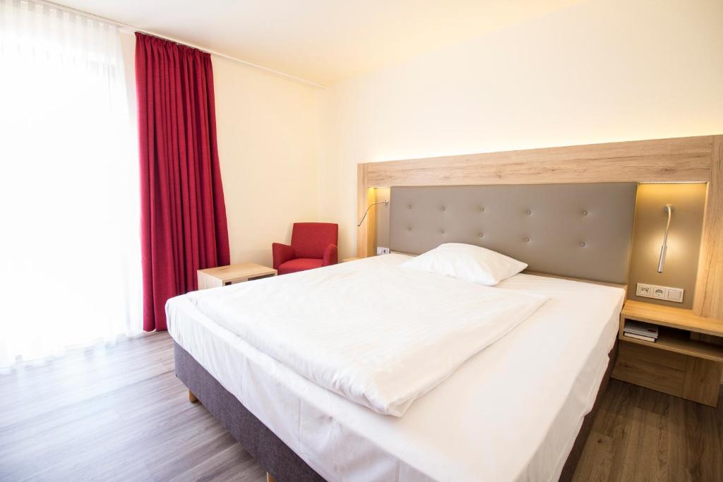 Postel nebo postele na pokoji v ubytování Arvena Park Hotel