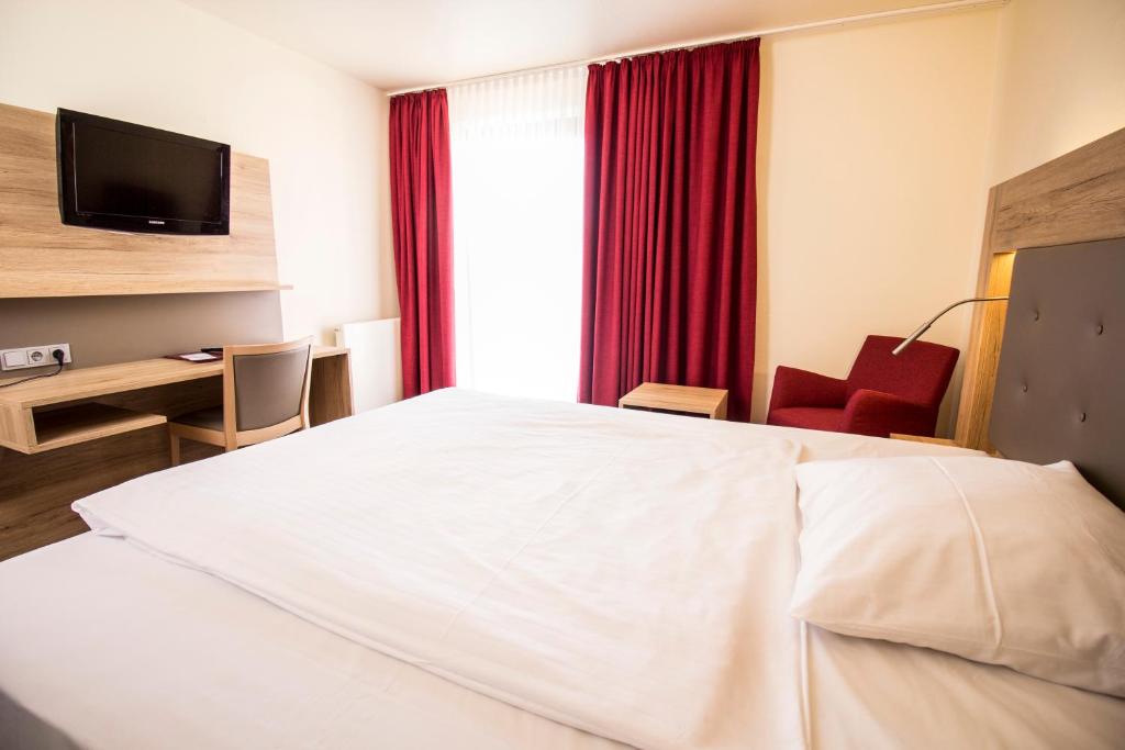TV a/nebo společenská místnost v ubytování Arvena Park Hotel