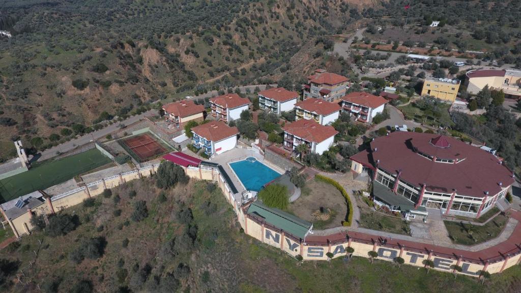 an aerial view of a large house with a swimming pool at Nysa Hotel in Sultanhisar