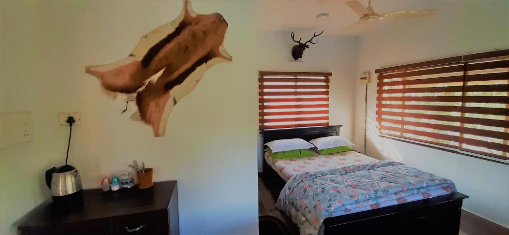 A bed or beds in a room at Noah's Nest Tree House
