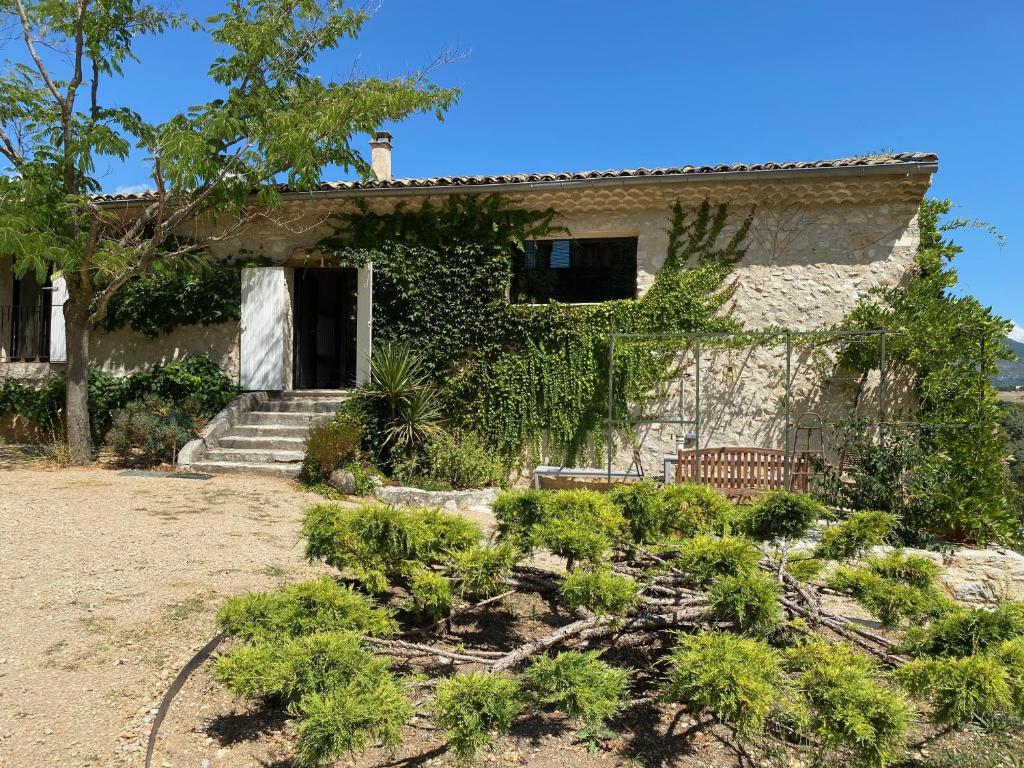 a house with a garden in front of it at Le Roet in Sisteron