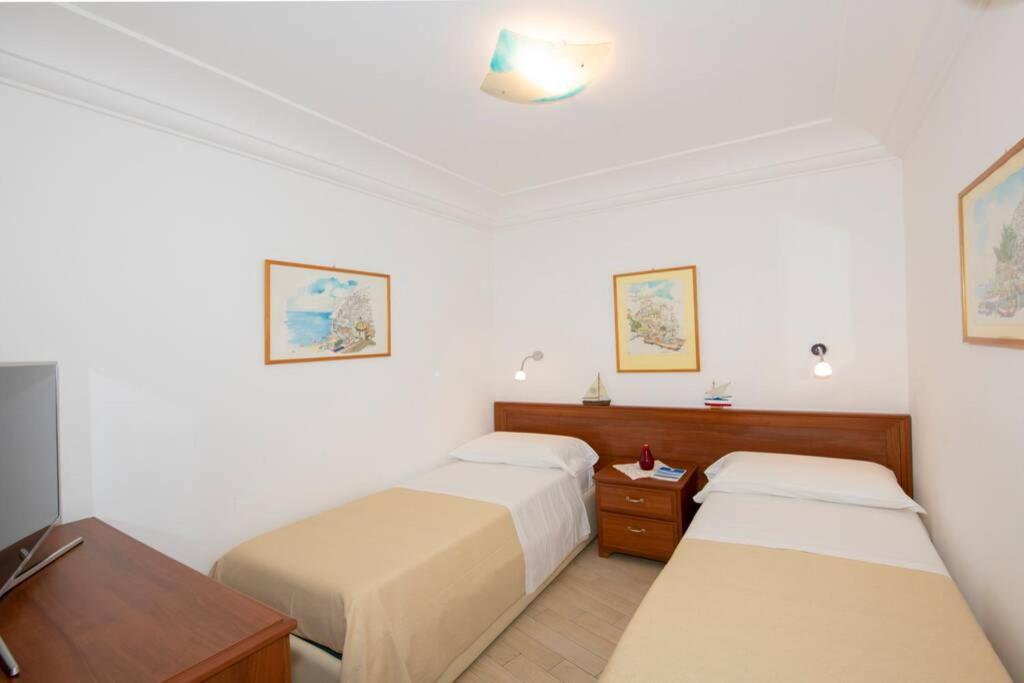 A bed or beds in a room at Il giardino dei limoni