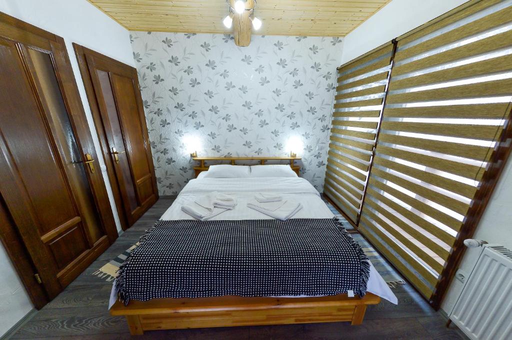 Postel nebo postele na pokoji v ubytování Frumusica