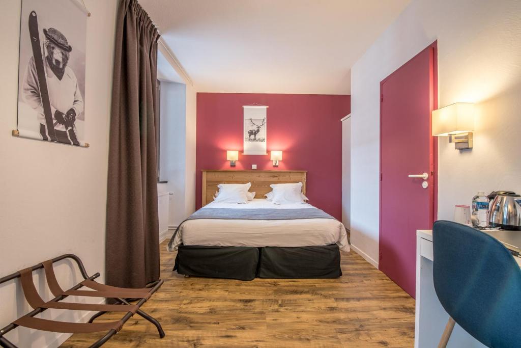 Postel nebo postele na pokoji v ubytování Hôtel Le Marintan