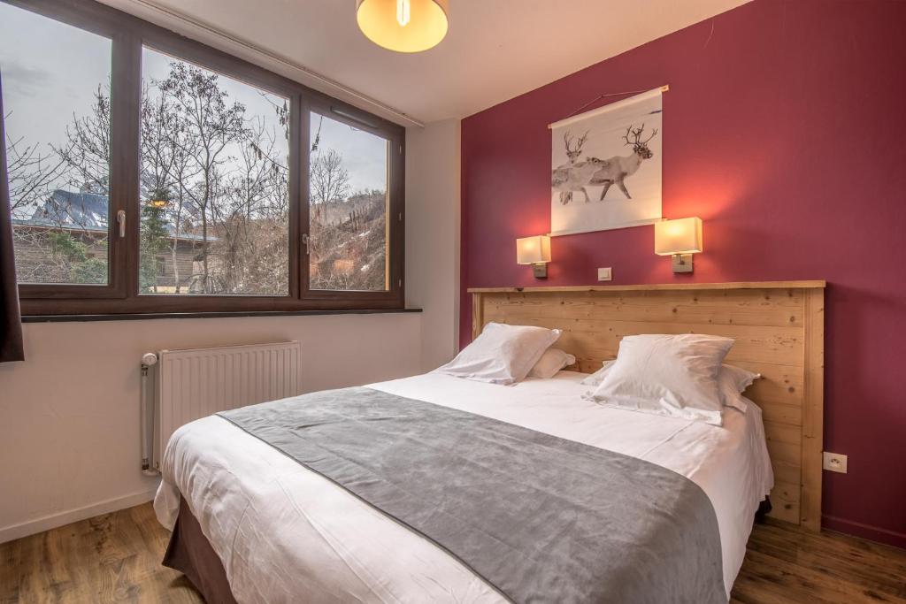 Postel nebo postele na pokoji v ubytování Hôtel Le Marintan