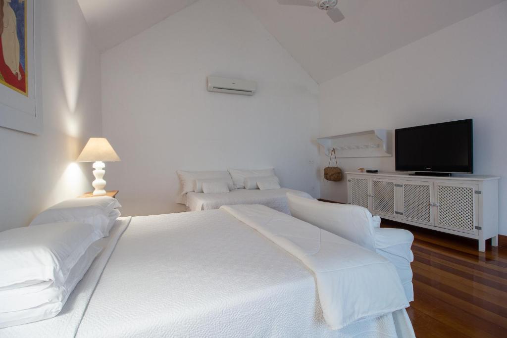 Postel nebo postele na pokoji v ubytování Pousada Casa de Paraty