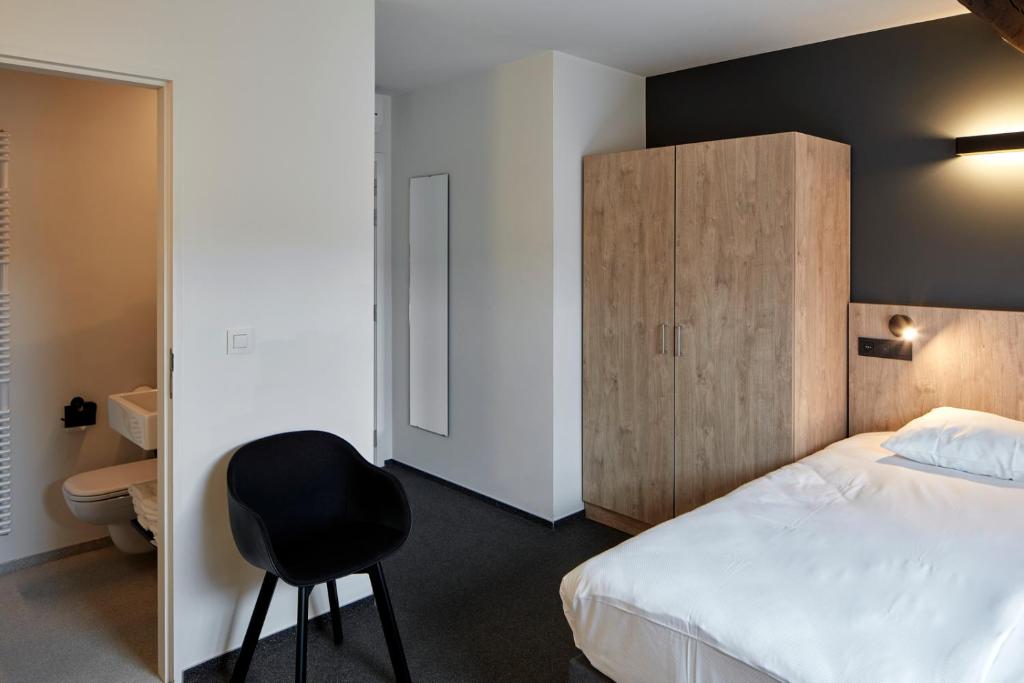 Postel nebo postele na pokoji v ubytování Alpha Hotel and Aparthotel