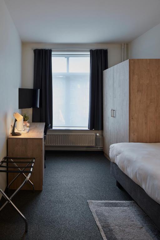 Postel nebo postele na pokoji v ubytování Alpha Hotel and Aparthotel