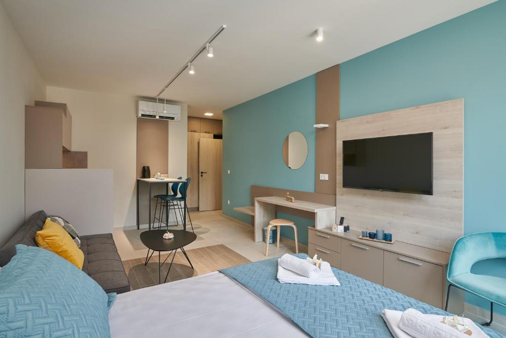 Televízia a/alebo spoločenská miestnosť v ubytovaní Tiffany Apartments