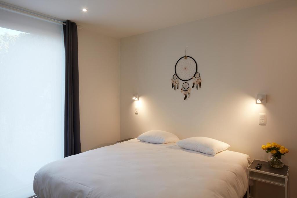 Postel nebo postele na pokoji v ubytování Alpha Hotel and Aparthotel