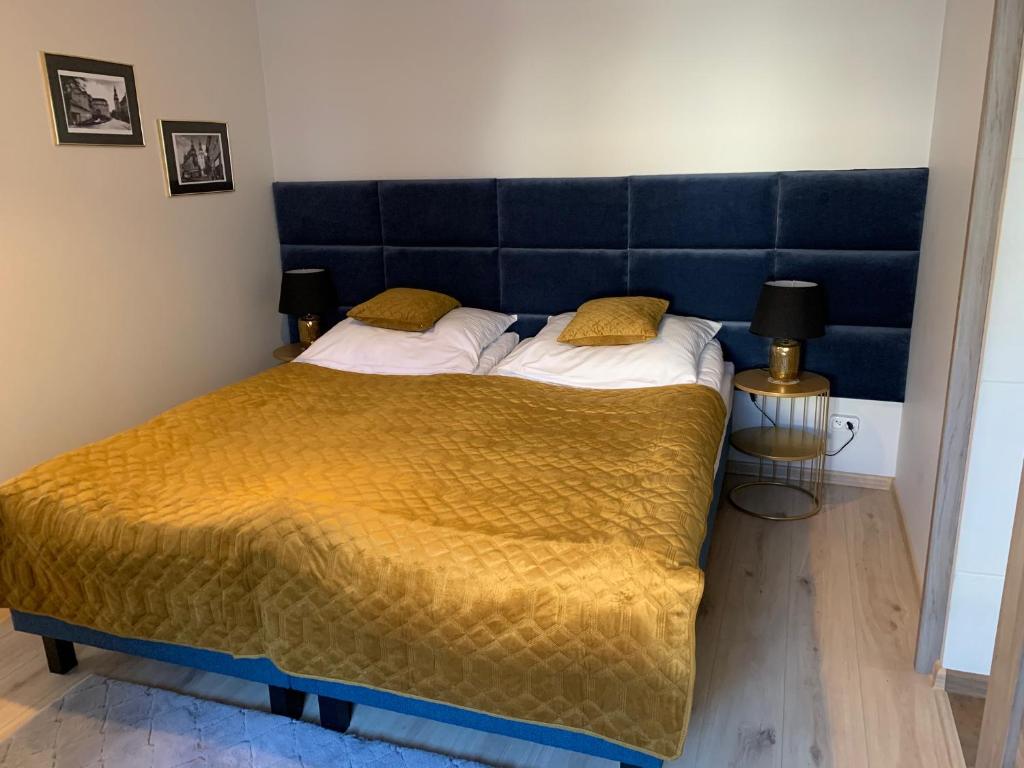 Posteľ alebo postele v izbe v ubytovaní Apartament Zdrojowy