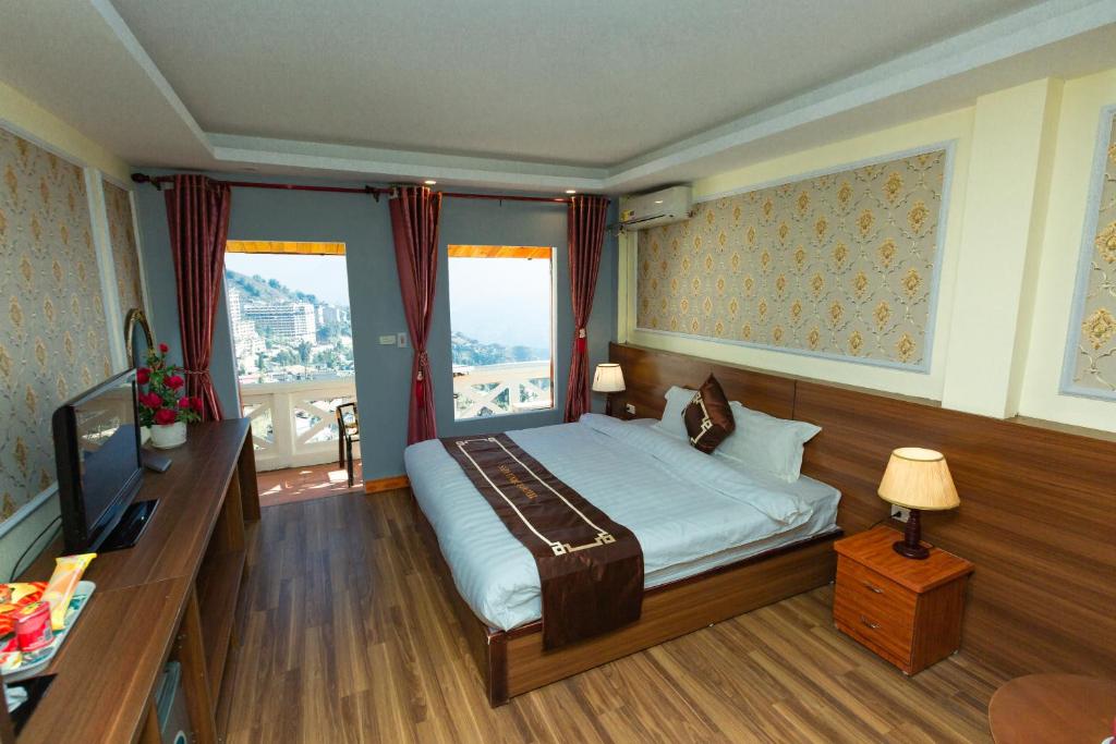 Postel nebo postele na pokoji v ubytování Sapa Unique Hotel
