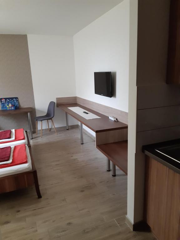Łóżko lub łóżka w pokoju w obiekcie M47 Vendégház-Airport